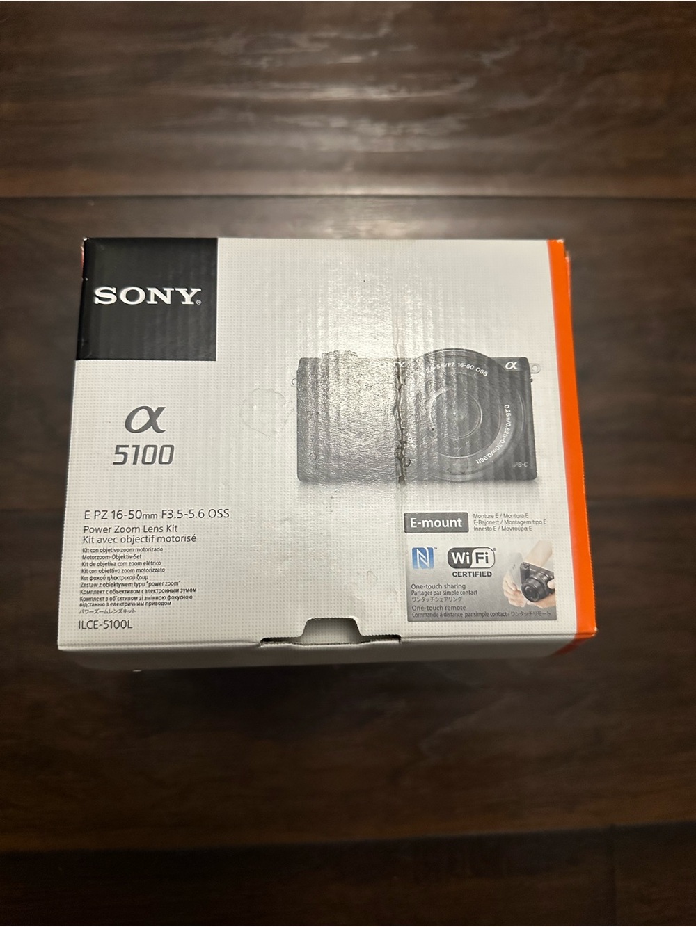 Sony Alpha 5100 Compact Mirrorless Camera Kit in White and Orange Accents